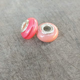 Briar rose pink shimmer and haur- rose gold shimmer and breastmilk (Right bead)