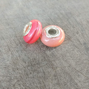 Briar rose pink shimmer and haur- rose gold shimmer and breastmilk (Right bead)