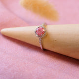 memorial ring with hair strands, opal flecks and briar rose pink shimmer