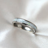Breastmilk, pearl white shimmer and heavy opalescent fleck, titanium band
