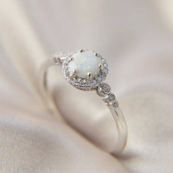 Hidden ashes ( hidden in centre), Pearl white shimmer and opalescent flecks-Old ring design ( stone is for colour inspiration only)