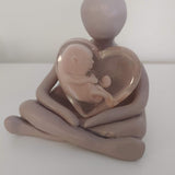 Sculpture with 2 babies at 10 weeks and 6 weeks