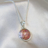 12mm round silver pendant, nude shimmer, lightly sprinkled ashes and pink opal