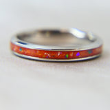 Titanium band, saffron orange shimmer , lightly sprinkled ashes and ocean green opal 