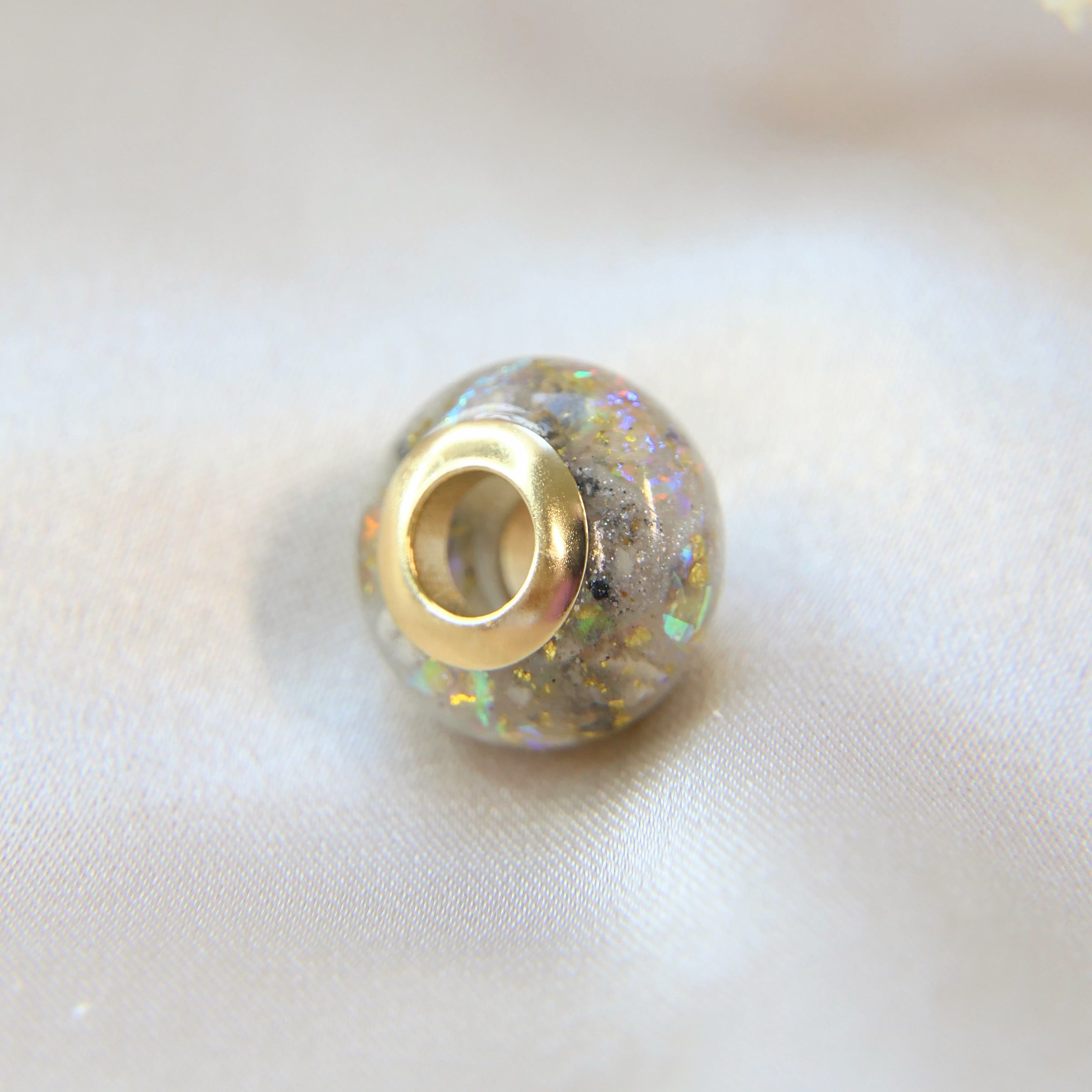 Ashes bead with opalescent flecks 