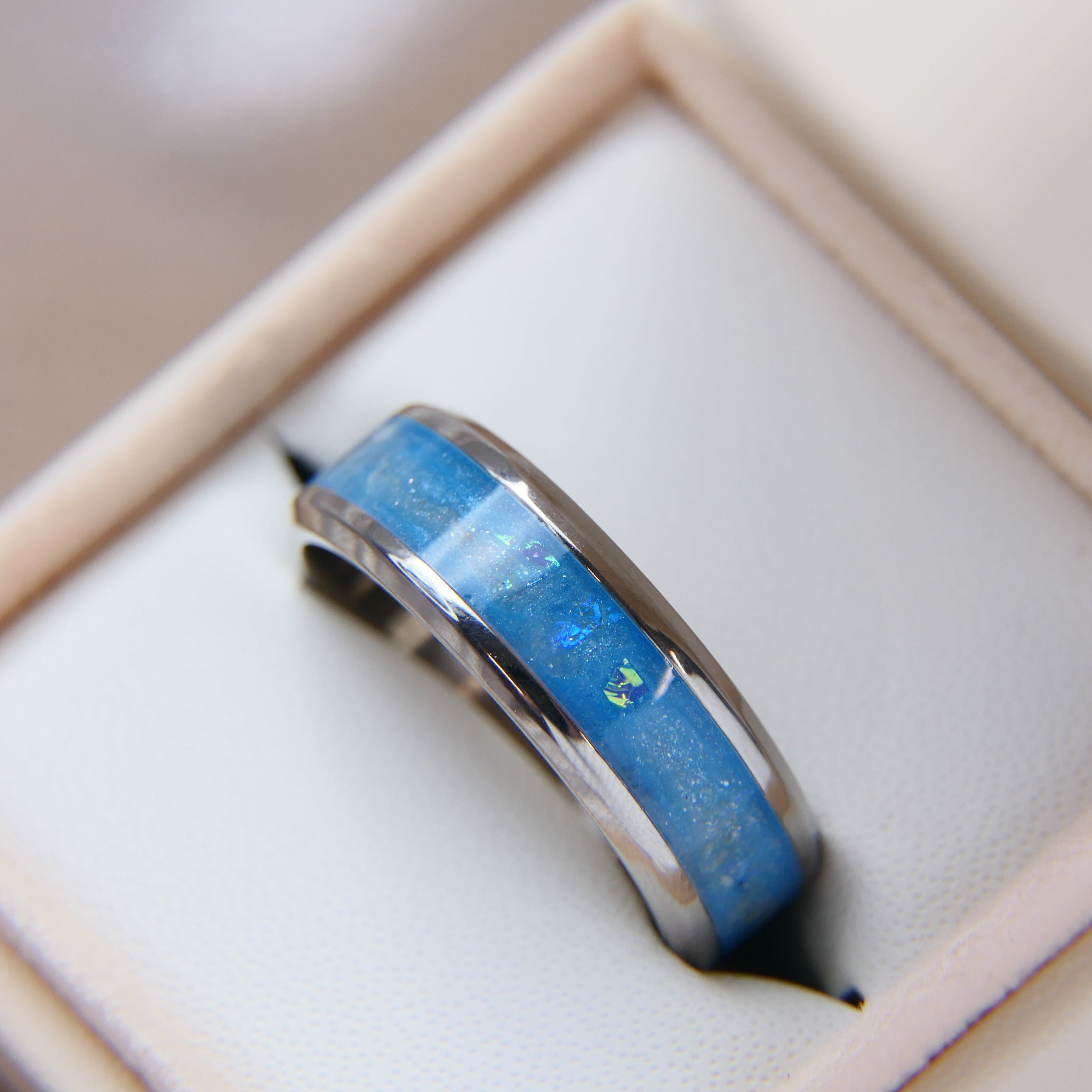 cremation keepsake ring with light blue shimmer, ashes and opalescent flecks