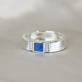 Lightly sprinkled ashes, sapphire blue, silver band 