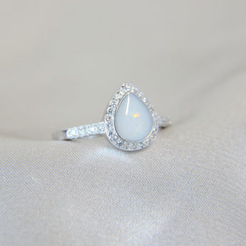 Breastmilk, pearl white shimmer and opalescent flecks 
