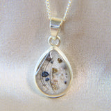 14 x 10 silver with pearl white shimmer, eyelashes and heavy sprinkled ashes