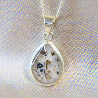 14 x 10 silver with pearl white shimmer, eyelashes and heavy sprinkled ashes