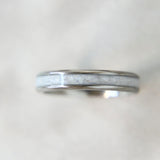 Lightly sprinkled ashes, pearl white shimmer, titanium band 