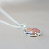 12mm round silver pendant, nude shimmer, lightly sprinkled ashes and pink opal