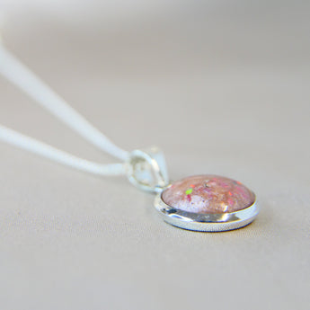 12mm round silver pendant, nude shimmer, lightly sprinkled ashes and pink opal