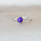 Violet shimmer, heavy ashes ( ashes are very fine), subtle silver flecks and  purple opal