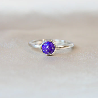 Violet shimmer, heavy ashes ( ashes are very fine), subtle silver flecks and  purple opal