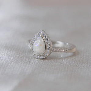 Milk, pearl white shimmer, subtle opalescent flecks 