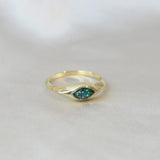 Gold marquise ring with forest green shimmer, heavy ashes, and ocean green opal 