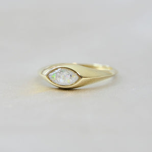 Gold marquise ring with pearl white shimmer, heavy ashes, and white opal 