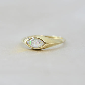 Gold marquise ring with pearl white shimmer, heavy ashes, and white opal 