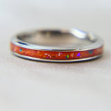 Titanium band, saffron orange shimmer , lightly sprinkled ashes and ocean green opal 