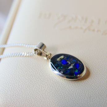 14 x 10 cremation pendant- charcoal grey shimmer, heavy ashes, cobalt blue opal and heavy blue flecks 