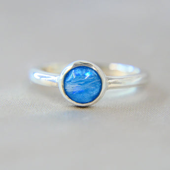 Pet fur, light blue shimmer, subtle opalescent flecks 