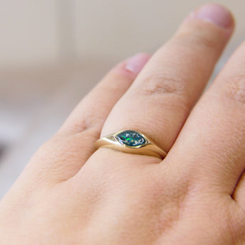 Gold marquise ring with forest green shimmer, heavy ashes, and ocean green opal 