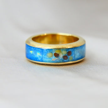 Yellow gold band, light blue shimmer, heavy opalescent flecks, mustard seeds