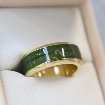 Yellow gold band, olive green shimmer, subtle opalescent flecks, hair, light ashes 