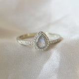 9k white gold ring with pearl white shimmer, lightly sprinkled ashes and subtle opalescent fleck