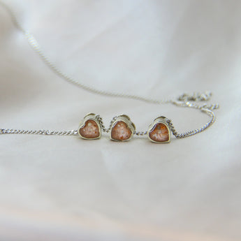 White gold hearts, nude shimmer, light ashes, subtle rose gold flecks 