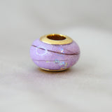 Milk, hair, lavendar grey shimmer, subtle opalescent flecks,  gold bead