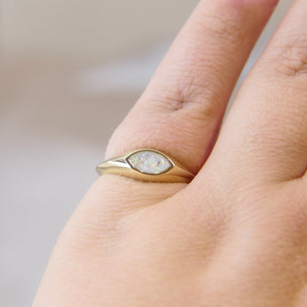 Gold marquise ring with pearl white shimmer, heavy ashes, and white opal 