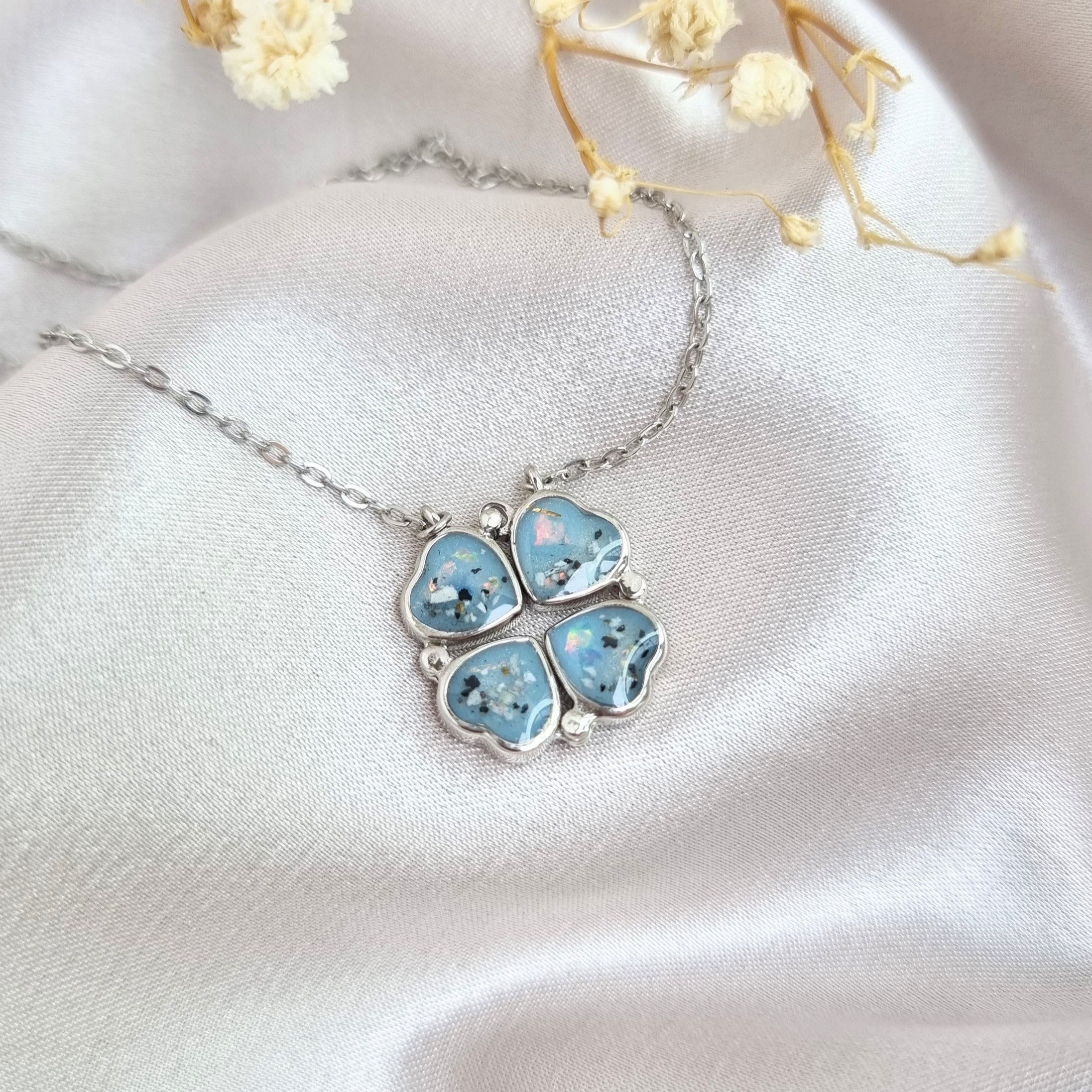 Ashes pendant with light blue shimmer, & crushed white opal