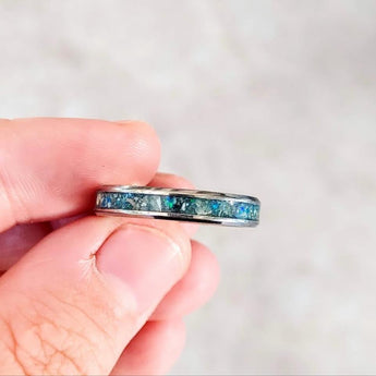 Titanium Memorial band with heavy ashes, charcoal grey shimmer, heavy blue flecks /cobalt blue opal