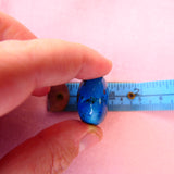 Umbilical cord with Sapphire blue shimmer, opalescent flecks and black crushed opal
