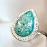 Ashes, teal green shimmer and crushed white opal