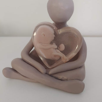 Sculpture with 2 babies at 10 weeks and 6 weeks